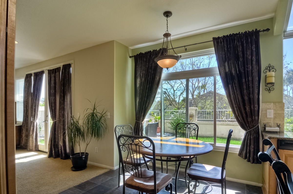 2315 Terraza Ribera Carlsbad, CA 92009 - Photo 12 of 25 KITCHEN OPENS TO FAMILY ROOM AND SLIDER TO PATIO AND BACKYARD