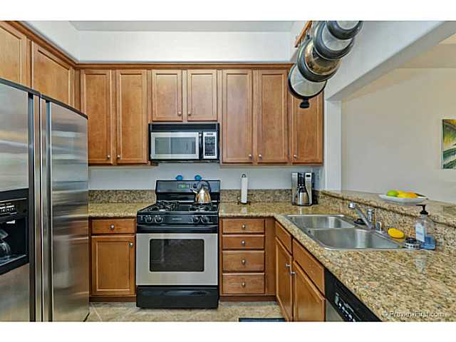 366 Forward Street, Unit E La Jolla, CA 92037 - Photo 8 of 23 Kitchen has pot rack, wine glass rack, granite countertops and stainless appliances