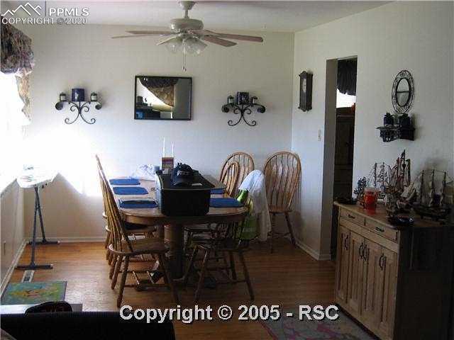 1219 Sunset Road Colorado Springs, CO 80909 - Photo 3 of 8 Dining Room with hardwood floors