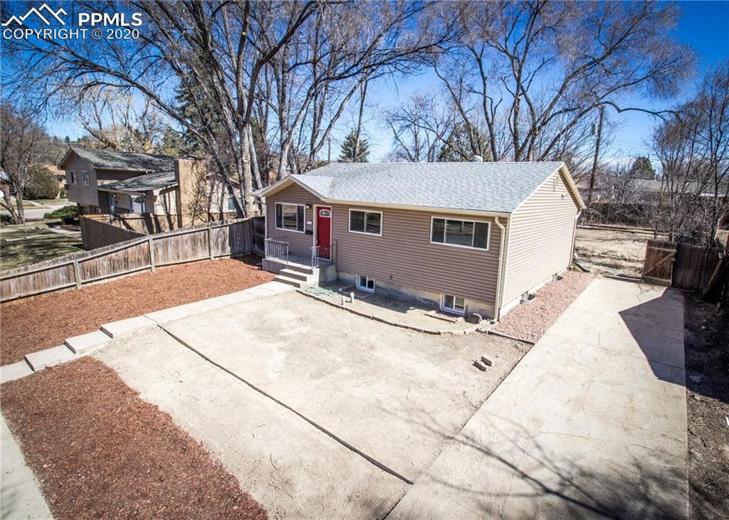 1531 Prairie Road Colorado Springs, CO 80909 - Photo 1 of 30 Aerial view of this completely remodeled home. There are mature trees in and around the property. There is a large backyard as well.