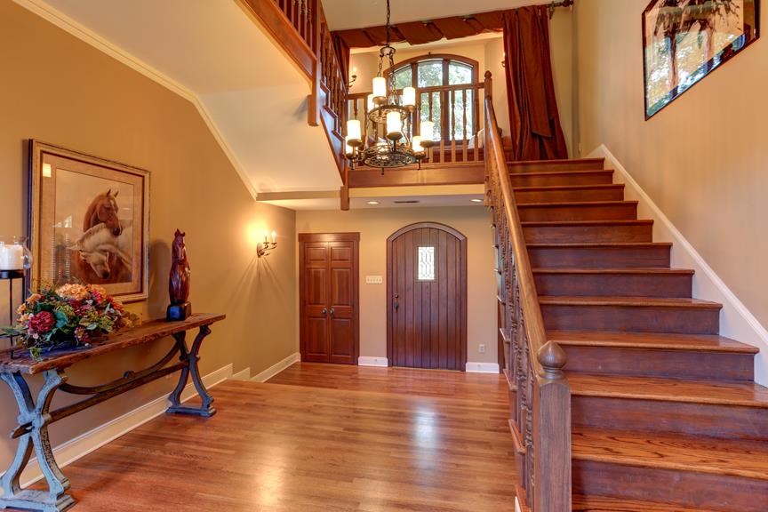 2590 Johnson Road Germantown, TN 38139 - Photo 2 of 25 A majestic residence with dramatic architectural details and remarkable upgrades! Beautiful, gleaming hardwood floors, including the entrance staircase.