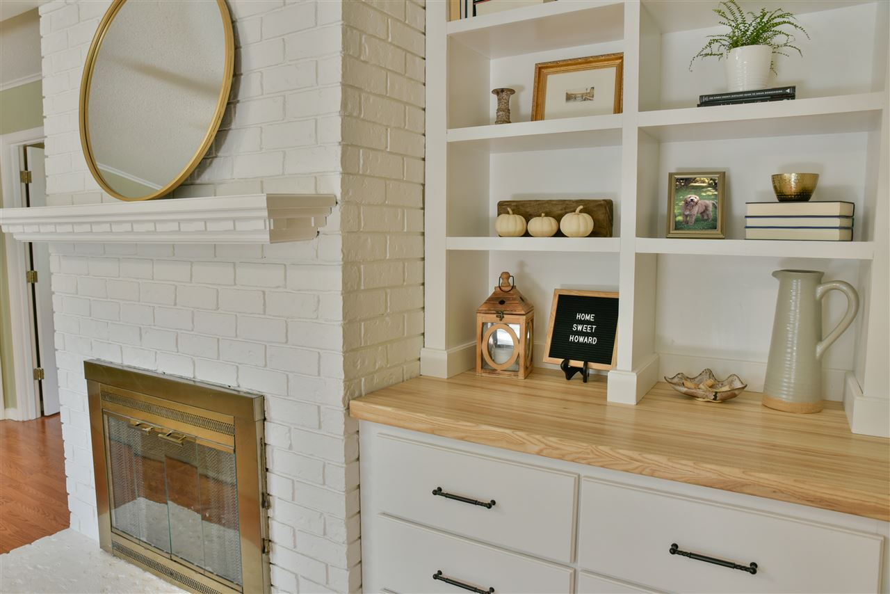 2202 Howard Road Germantown, TN 38138 - Photo 14 of 25 The back side of the two-sided fireplace with custom built-ins.