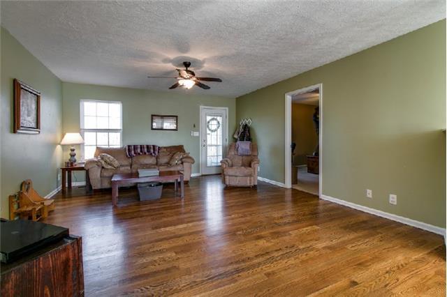 2000 Orion Jones Road Chapmansboro, TN 37035 - Photo 6 of 27 Another living room view showcasing the finished hardwood floors |