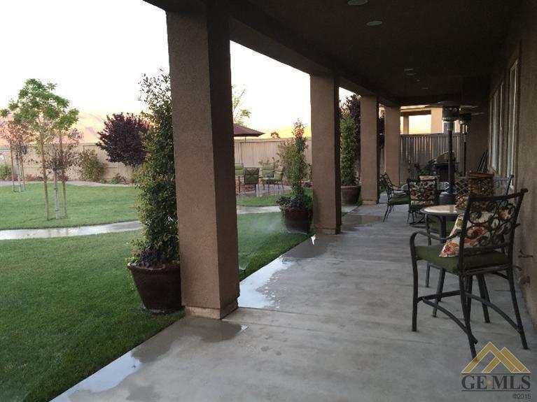 14410 Raphael Avenue Bakersfield, CA 93306 - Photo 15 of 20 Large cover patio extends along back of house.