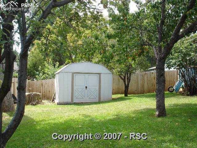 301 Clarksley Road Manitou Springs, CO 80829 - Photo 14 of 16 Yard with Fruit Trees and a Shed