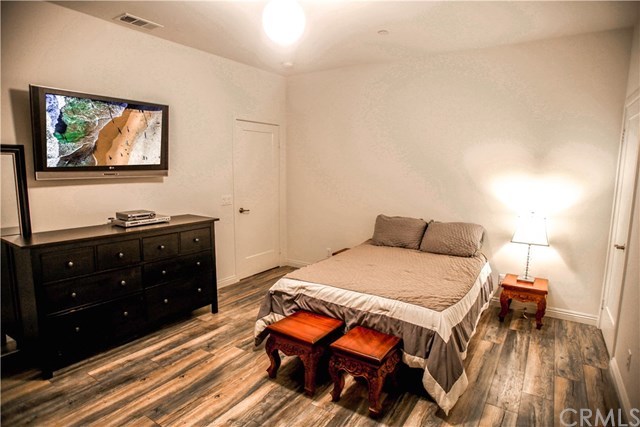 112 Acamar Irvine, CA 92618 - Photo 9 of 14 First Level Bedroom With En Suite Bath