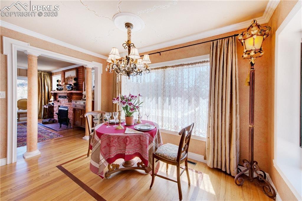 7955 Highway 24 Cascade, CO 80809 - Photo 13 of 36 The dining room is light and bright thanks to two large windows.