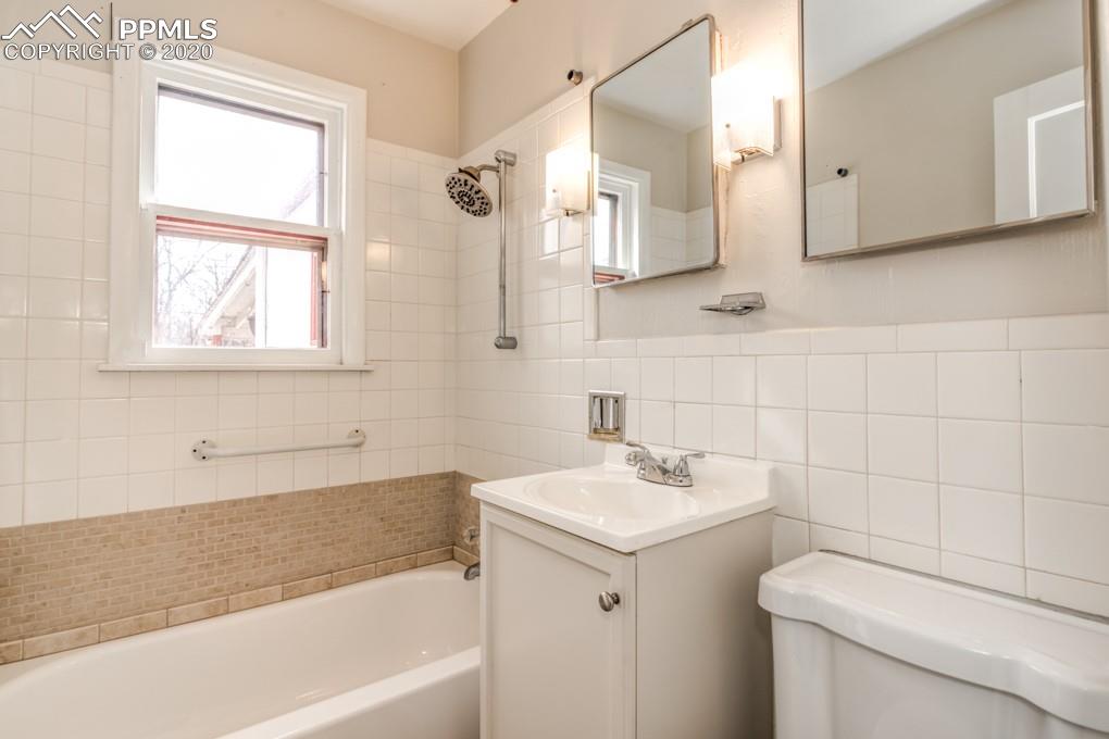 611 Prairie Road Colorado Springs, CO 80909 - Photo 11 of 18 Centrally located in the home for family and guests.