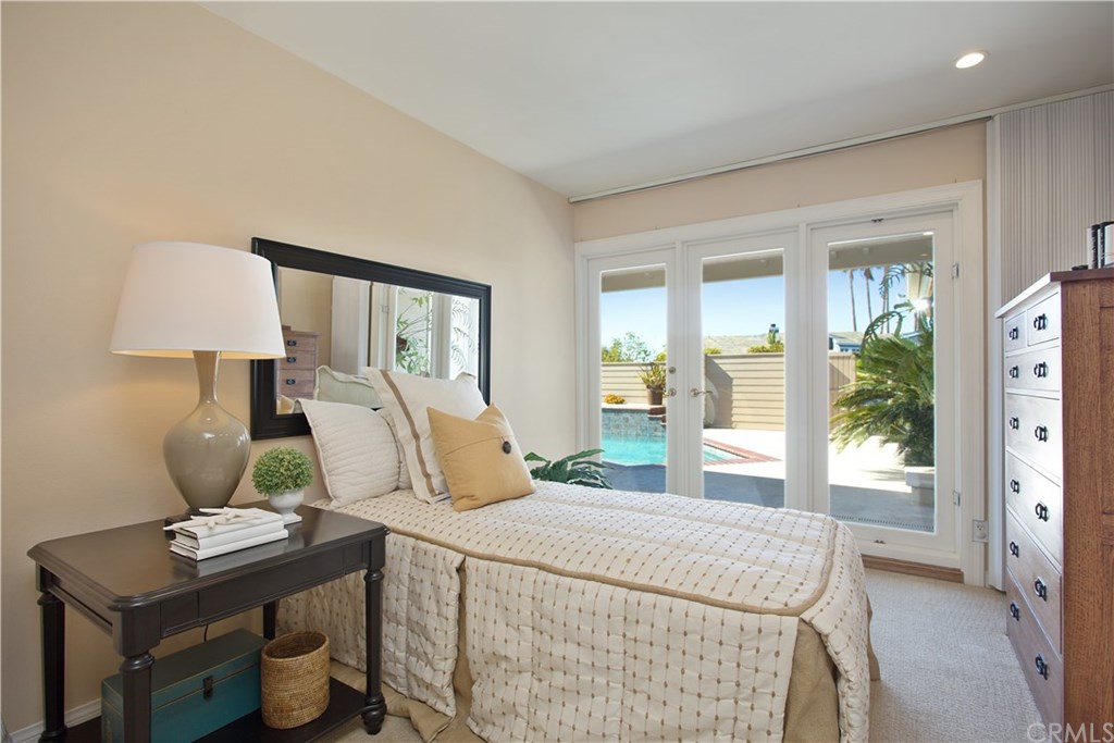 1588 Skyline Drive Laguna Beach, CA 92651 - Photo 13 of 18 Second bedroom with custom closets and direct access to the swimming pool and enclosed patio.