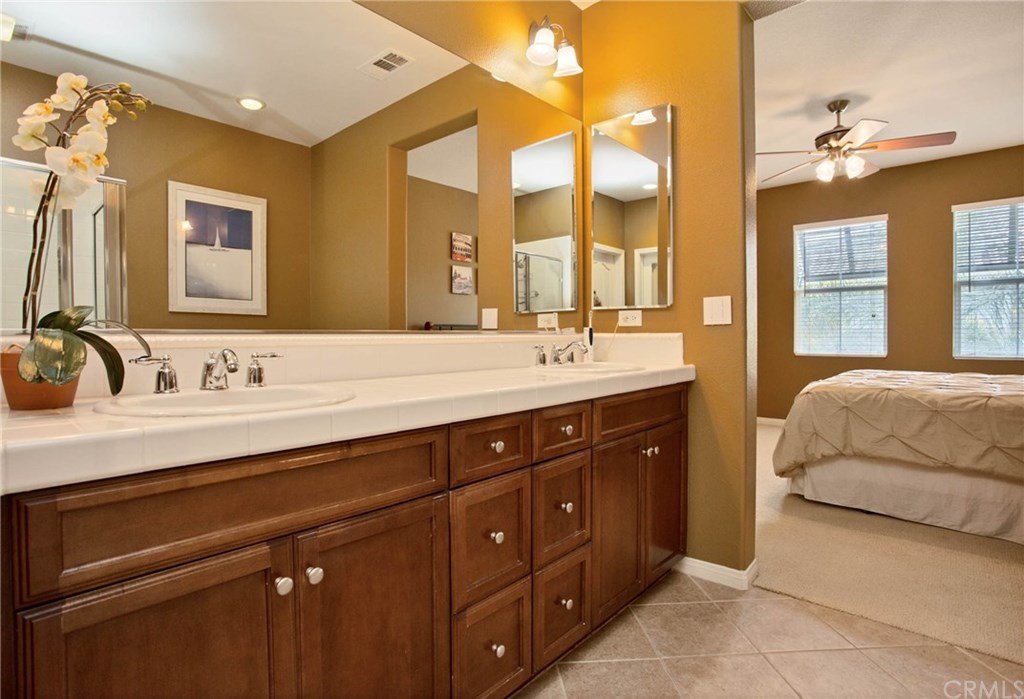 21 Corte Javier San Clemente, CA 92673 - Photo 18 of 30 Dual sinks, lots of counter space and warm finished cabinetry make this the perfect master bathroom.