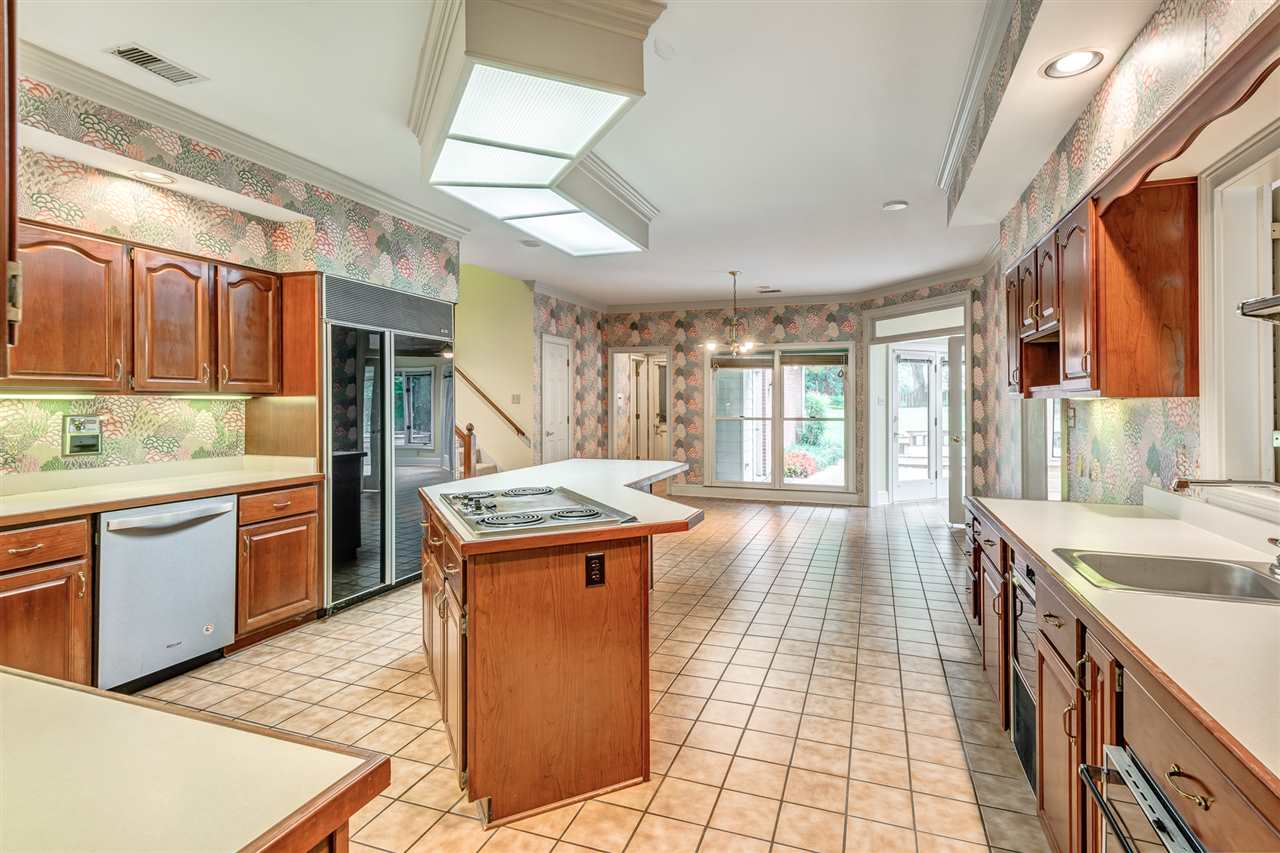 2044 Steeplebrook Drive Memphis, TN 38016 - Photo 8 of 25 Pass through window with Shutters ~ Open plan ~ tiled floor ~ New Dishwasher in 2017