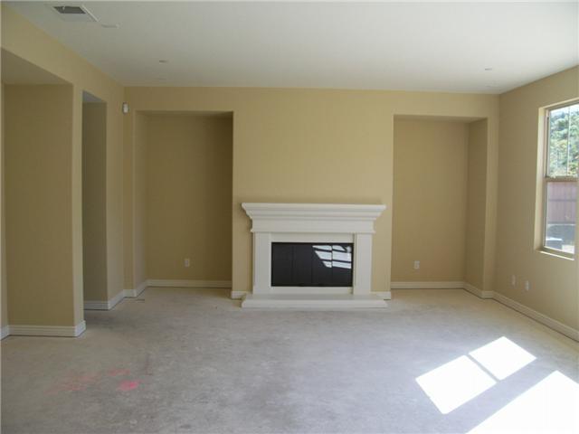 14565 Whispering Ridge Road San Diego, CA 92131 - Photo 5 of 6 Large sunny family room with fireplace, surround sound pre-wire