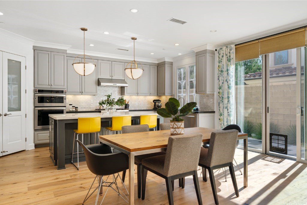 116 Mosswood Irvine, CA 92620 - Photo 8 of 42 Another view of the bright dining area and kitchen.