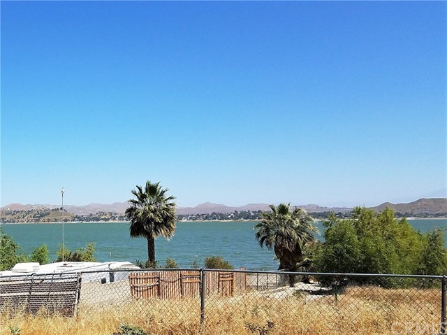 Amazing unobstructed views of the lake and mountains from this R3 buildable 71,000 sf lot. 120 ft white water beach front, 120 ft on Grand Ave, and about 660 ft deep. How would you like to live on the water front on Lake Elsinore??