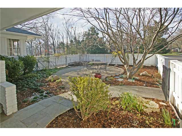 4310 Minden Road Memphis, TN 38117 - Photo 2 of 10 Front courtyard with extraordinary Japanese maple for canopy, walkway and front porch paved with bluestone