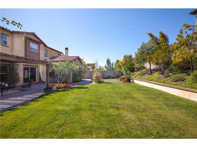 6989 Corte Langosta Carlsbad, CA 92009 - Photo 25 of 25 Another angle of the yard with the putting green off in the distance. Fabulous, flat, usable space.