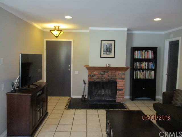 2015 Bataan Road, Unit 105 Redondo Beach, CA 90278 - Photo 5 of 15 View while pointing at fireplace and entry door from balcony.