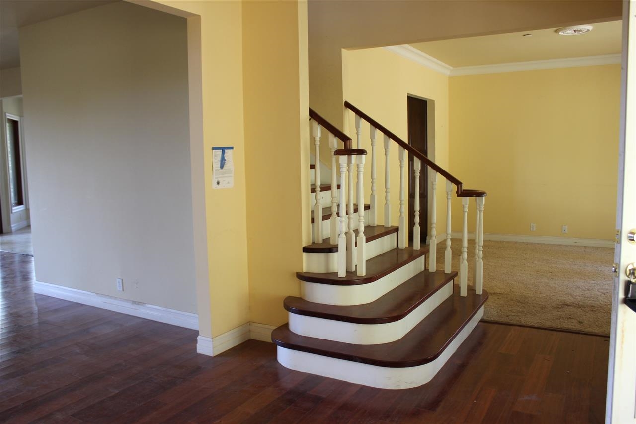 1028 Julian Estates Road Julian, CA 92036 - Photo 11 of 25 Lovely hardwood floors and staircase leading to the balcony/alcove and bedrooms upstairs.
