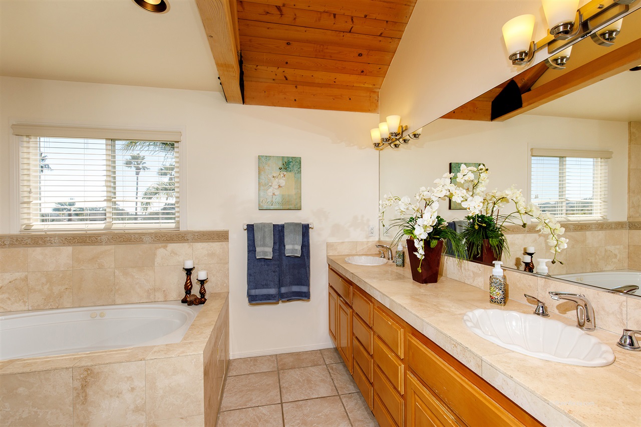 449 Ocean View Avenue Encinitas, CA 92024 - Photo 15 of 23 Large jetted tub and double sink in tiled master bathroom