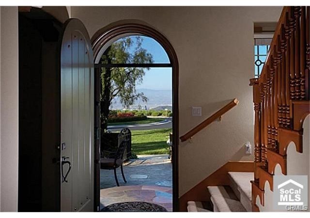 4 San Sovino Newport Coast, CA 92657 - Photo 2 of 8 Entrance of home featuring mountain and city light views!