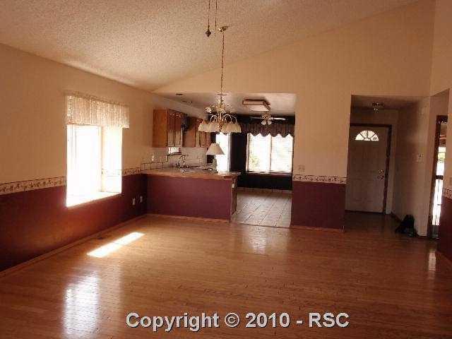 17285 Lodgepole Road Peyton, CO 80831 - Photo 4 of 15 Livingroom to kitchen area