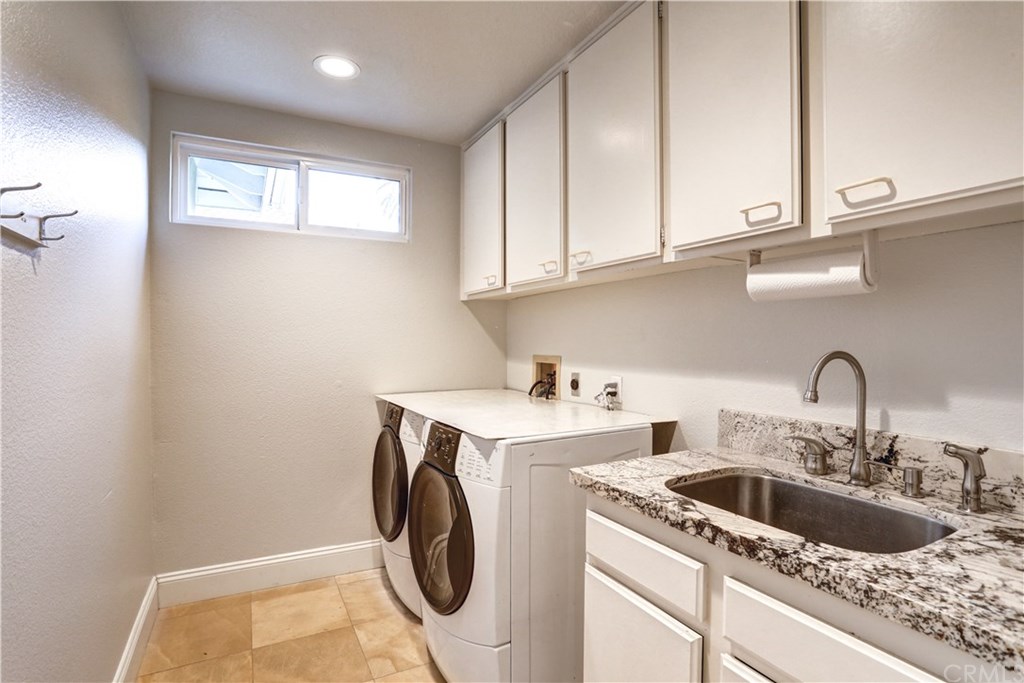 6 Via Colorso San Clemente, CA 92672 - Photo 19 of 32 Downstairs, dedicated laundry room with sink and lots of cabinet space for storage!