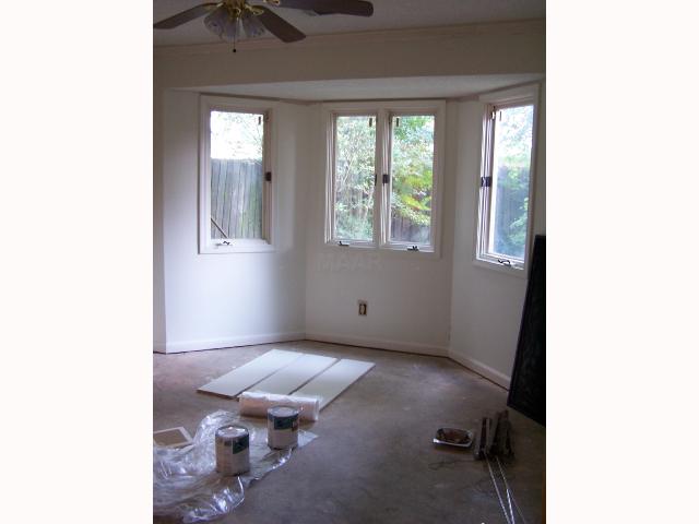 7115 Belsfield Road Memphis, TN 38119 - Photo 7 of 9 Second bedroom with bay window and walk in closet. Needs flooring.