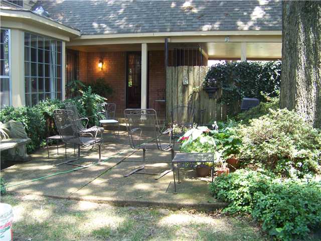 5441 Walnut Grove Road Memphis, TN 38120 - Photo 22 of 25 Covered porch area plus large patio with built in gas grill. Tall mature trees everywhere!!