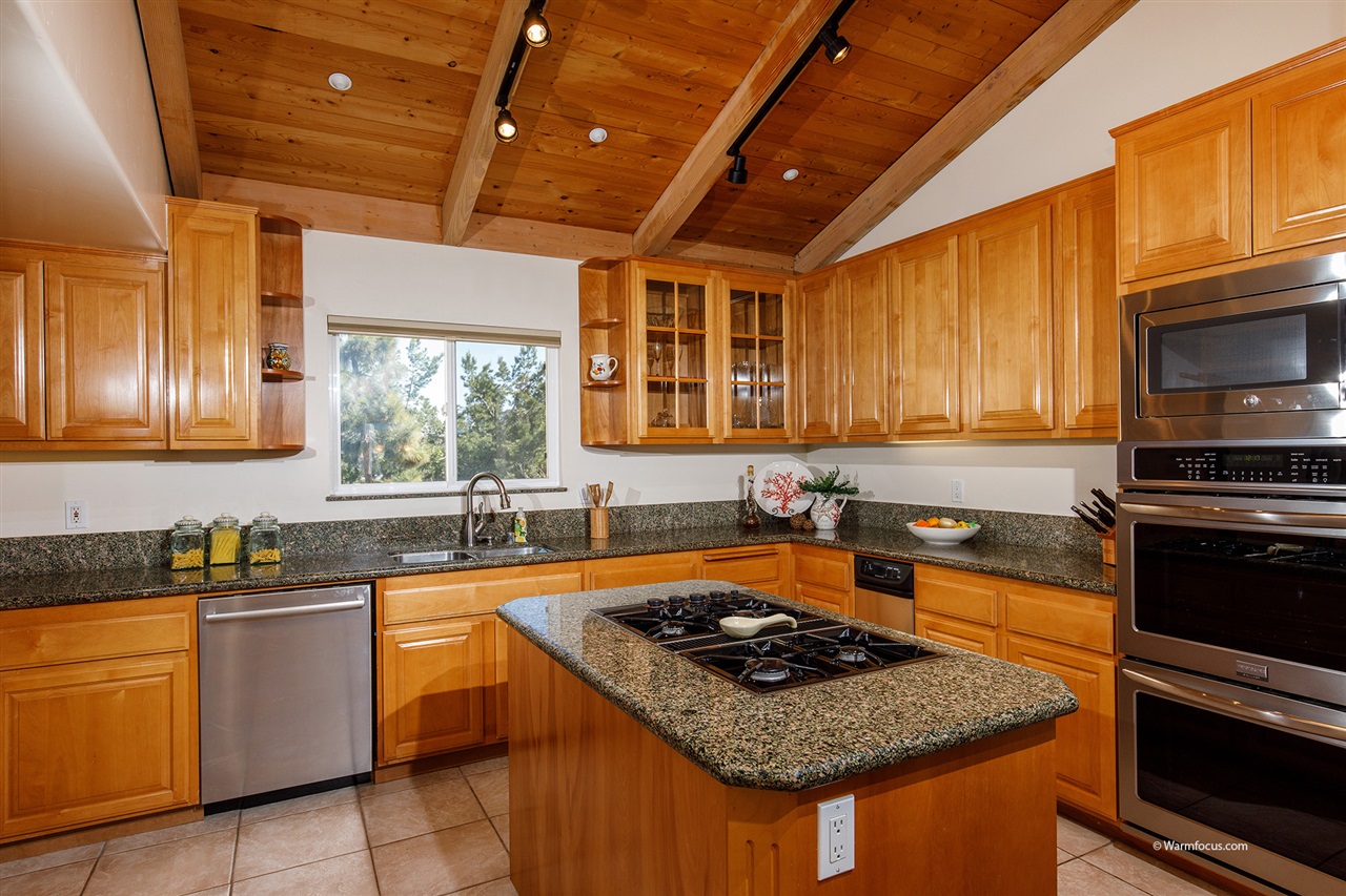 449 Ocean View Avenue Encinitas, CA 92024 - Photo 10 of 23 Double ovens, top appliances, and high ceilings in the kitchen