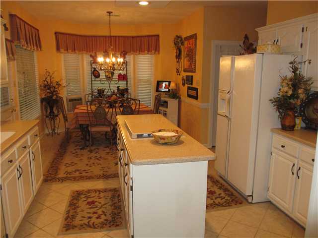 439 Brook Ridge Circle Cordova, TN 38018 - Photo 4 of 16 Kitchen has large tile & island, lots of cabinet space & pantry in addition to a walk-in laundry room & half bath by garage door.