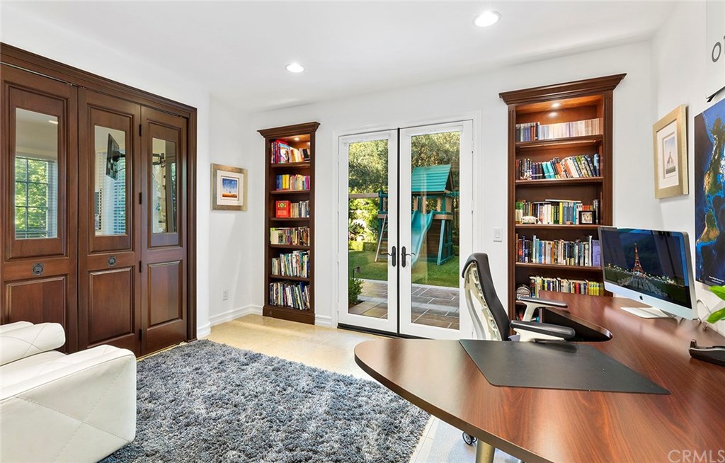 20 Highpoint Irvine, CA 92603 - Photo 20 of 65 Downstairs bedroom (Currently being used as an office) featuring a retreat through the folding wood doors and an ensuite bath