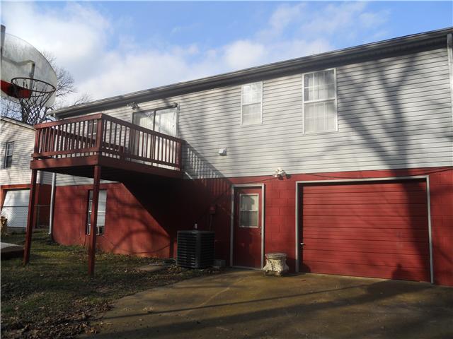232 Manzano Road Madison, TN 37115 - Photo 3 of 30 View of the back of the home. The deck is conveniently located off of the dining area upstairs, a quiet place for enjoying a cup of coffee in the morning. The basement has a great rec room and here's the access to the one car garage.