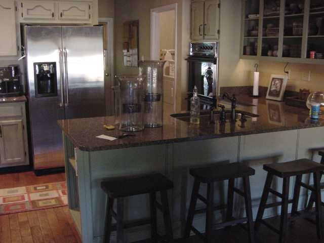 970 Yorktown Road Collierville, TN 38017 - Photo 2 of 8 Kitchen -hardwood floors, new quartz countertops, new fixtures, glazed cabinets. This breakfast bar overlooks the keeping room.