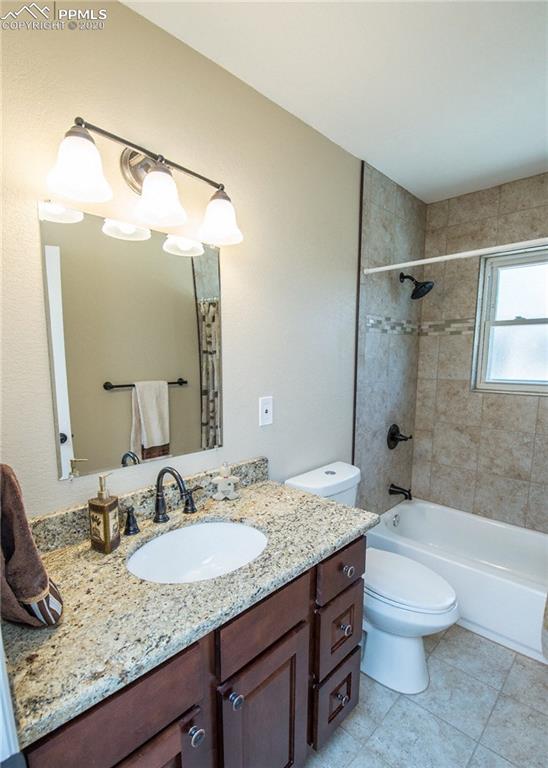 1531 Prairie Road Colorado Springs, CO 80909 - Photo 14 of 30 Full bathroom on the main level has been completely remodeled. Notice the tile inlays in the tub/shower surround.