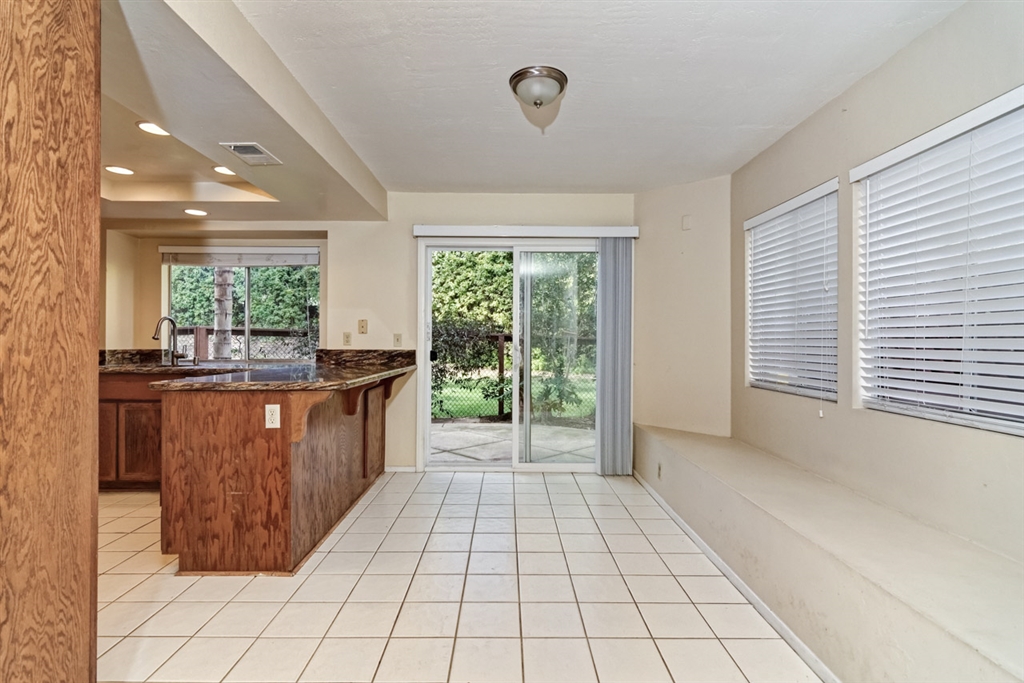 1196 Huntington Road San Marcos, CA 92078 - Photo 4 of 25 Conveniently located between the kitchen and family room with a slider to the patio