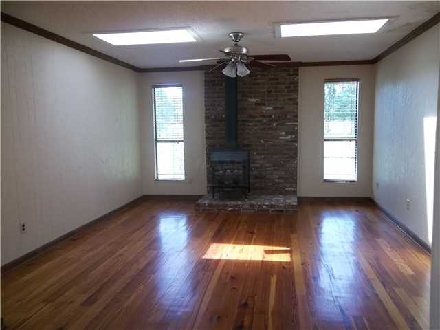 Keeping Room with wood burning stove.  Two skylights allow lots of natural light into the home.