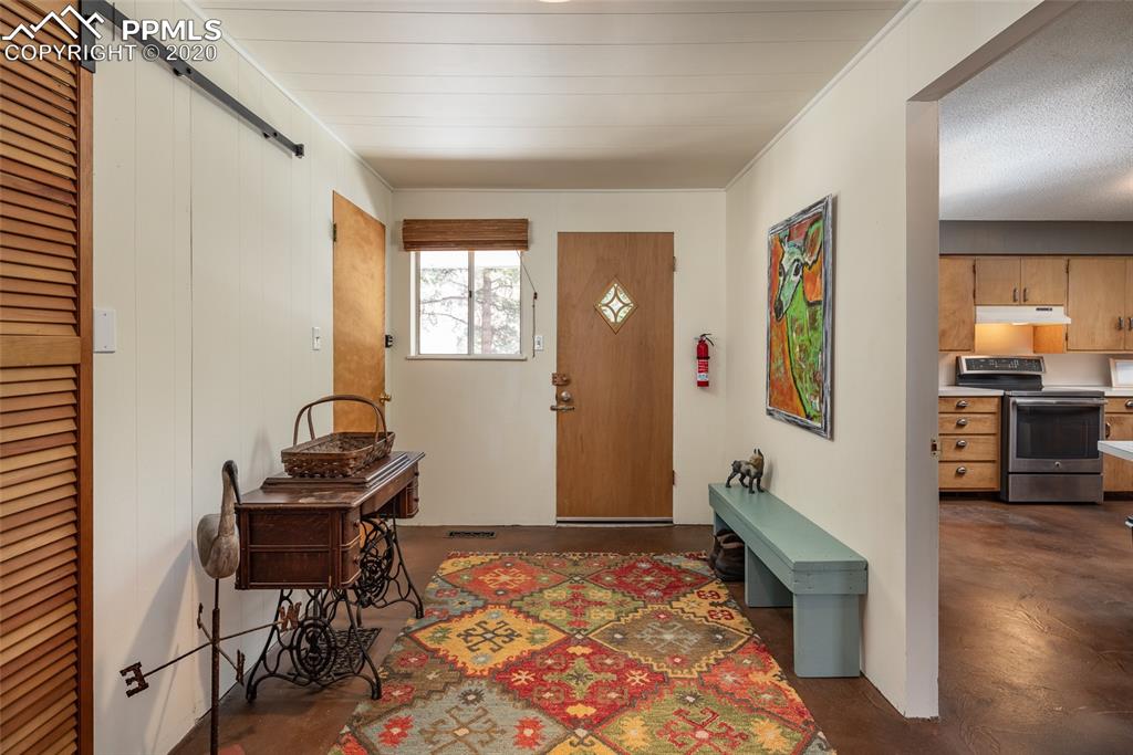 8715 Chipita Park Road Cascade, CO 80809 - Photo 25 of 33 Mudroom with access to the front and the back yards.