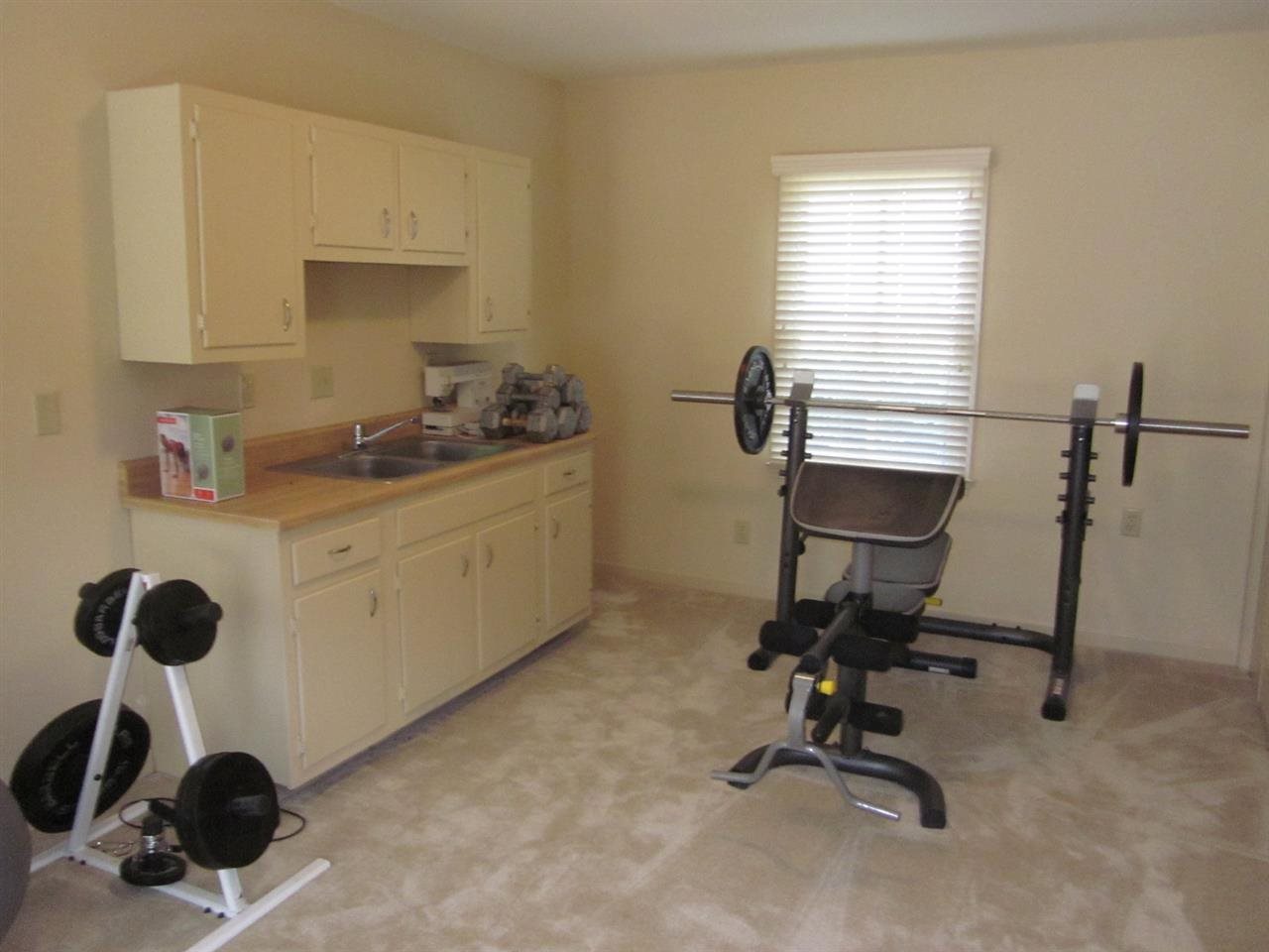 5382 Mason Road Memphis, TN 38120 - Photo 17 of 24 The inlaw suite has a large living area and a kitchenette.