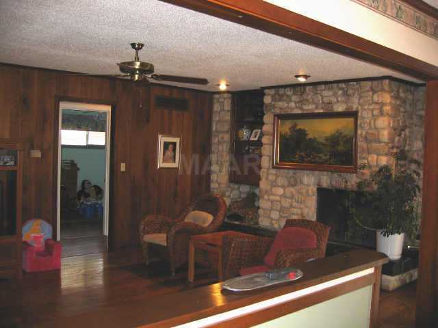6321 Trafalgar Road Memphis, TN 38134 - Photo 3 of 8 Gleaming hardwood floors and stone fireplace