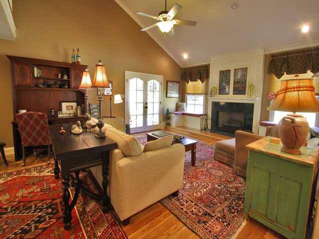 2789 Scarlet Road Germantown, TN 38139 - Photo 2 of 12 This large family room has two sets of french doors leading to covered porches. The breakfast room and the foyer also connect to this lovely room with 4 inch hardwood, built in window seats, and and a fireplace.
