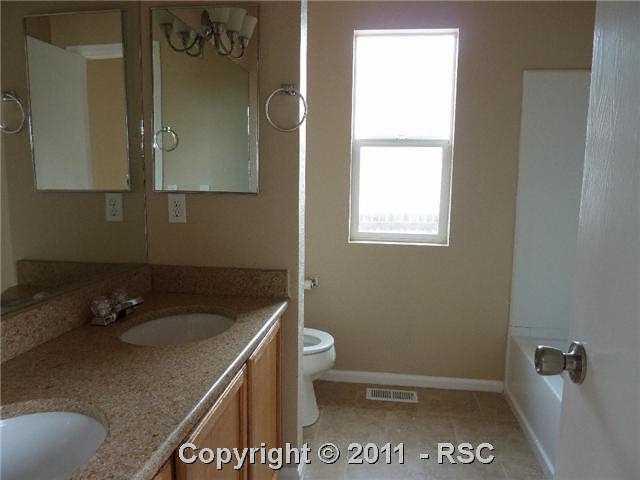 12337 Crystal Downs Road Peyton, CO 80831 - Photo 9 of 13 Duel sinks in the adjoining master bathroom