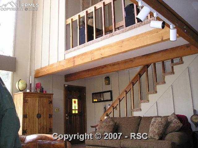 550 Rock Ridge Road Palmer Lake, CO 80133 - Photo 11 of 15 Stair Case to Upper Level