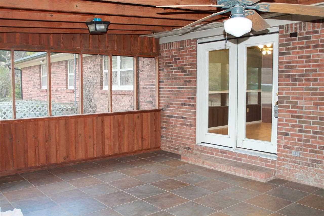 4984 Holly Grove Road Brighton, TN 38011 - Photo 6 of 15 just through the French doors, you'll find this perfect sized screened porch with tile flooring