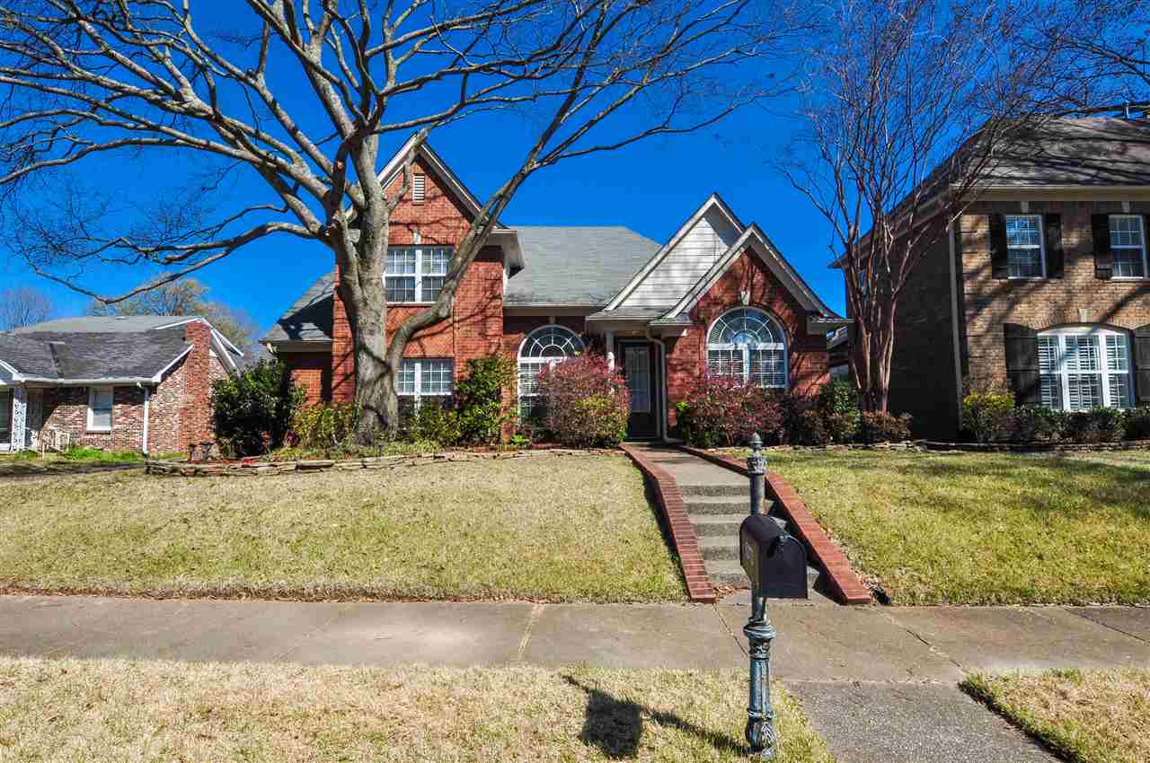 5272 Mesquite Road Memphis, TN 38120 - Photo 2 of 22 The low maintenance brick exterior is surrounded by lush landscaping with stone and brick accents.