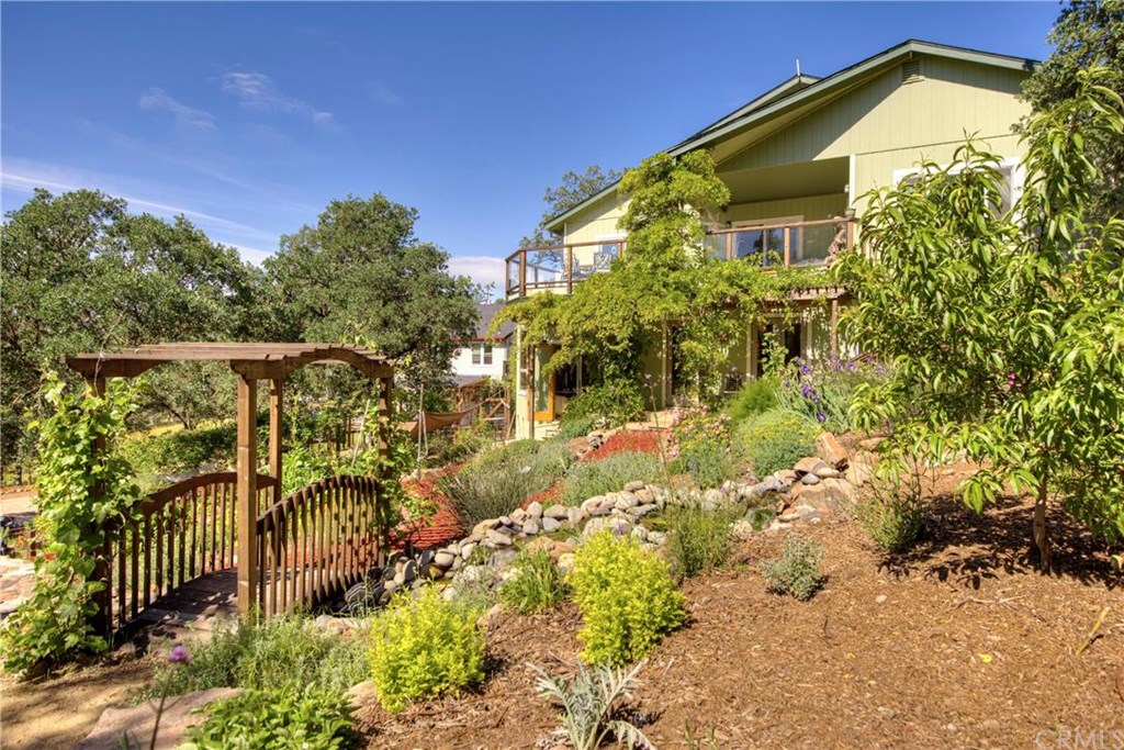 19345 Moon Ridge Road Hidden Valley Lake, CA 95467 - Photo 1 of 1 A true Garden Paradise... meandering pathways through the garden with many different zones of flowers, herbs and more...