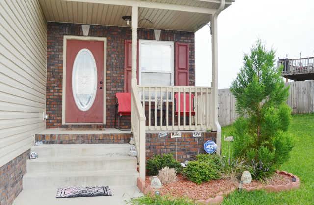 Covered Porch and beautiful landscaping