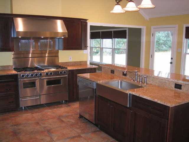 208 Colonial Road Memphis, TN 38117 - Photo 4 of 10 A chef's dream kitchen! Double ovens, six-eye gas cooking with griddle and grille attachments. One-piece sink. High-end dishwasher and microwave.