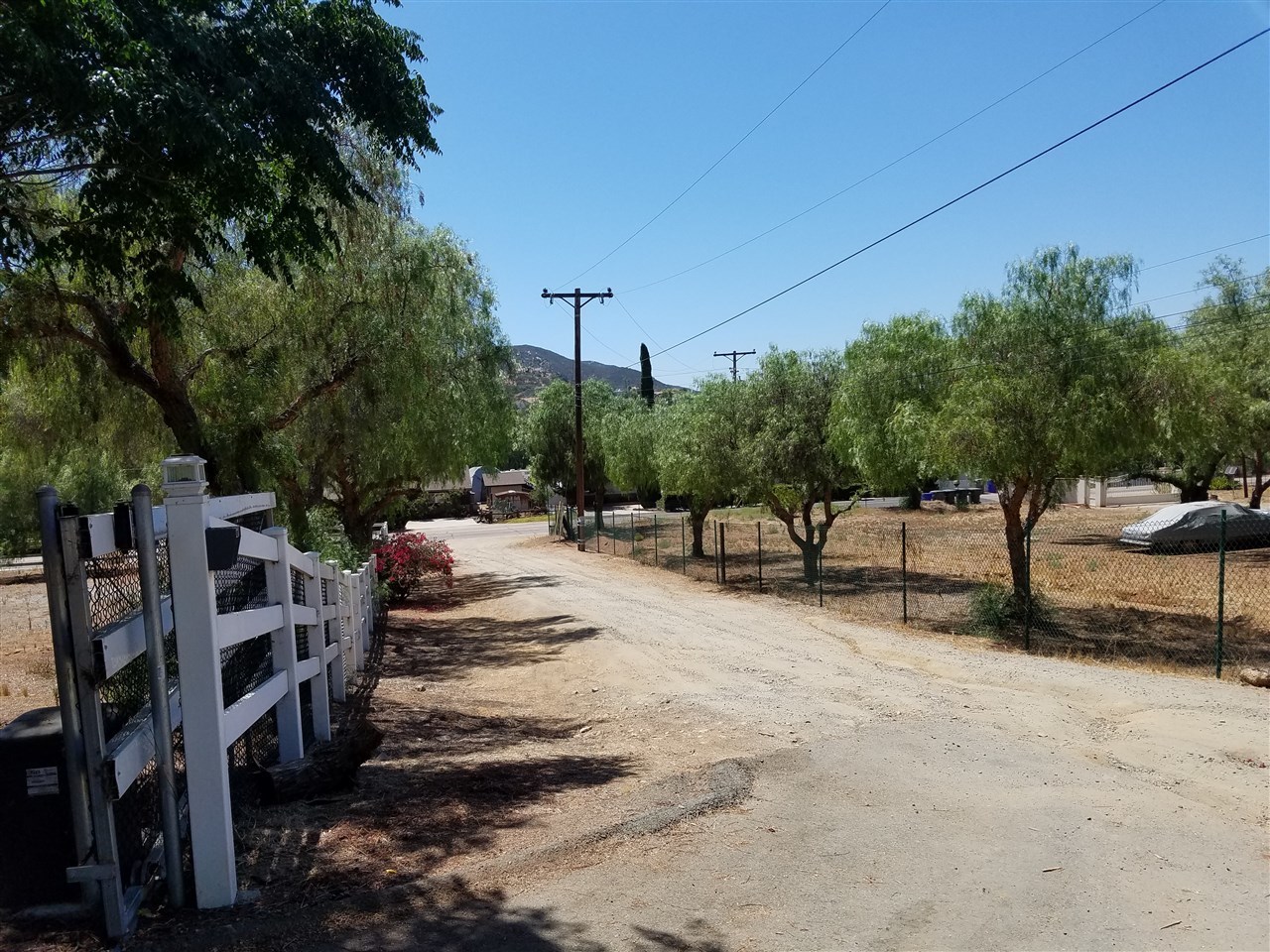 13903 Proctor Valley Road Jamul, CA 91935 - Photo 2 of 18 main road is paved, short, unpaved easement road leads to property