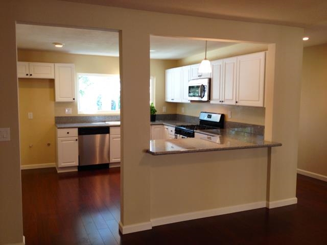9722 Abbeywood Road Santee, CA 92071 - Photo 7 of 21 VIEW FROM DINING ROOM LOOKING TOWARDS KITCHEN, SHOWING BREAKFAST BAR.
