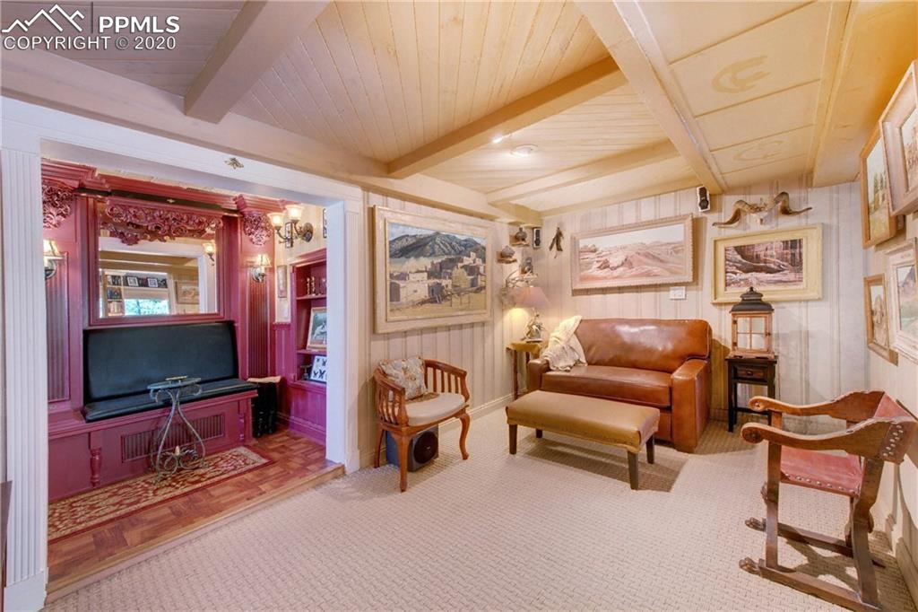 7955 Highway 24 Cascade, CO 80809 - Photo 21 of 36 Family room and adjacent wet bar, The Wee Bee.